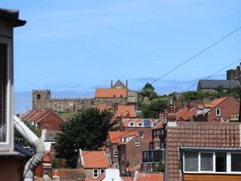 A view of rooftops and a church at 4 Studley Terrace Whitby