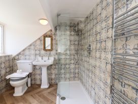 A bathroom with shower and sink at 4 Studley Terrace in Whitby