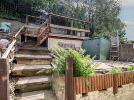 A garden with steps leading to a deck at 4 Studley Terrace Whitby