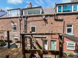 A view of buildings with a wooden deck at 4 Studley Terrace Whitby