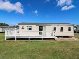 An outdoor view of a mobile home with a deck at Rowan View 251