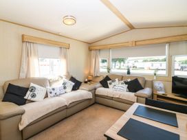 A living room with a sofa and coffee table at Rowan View 251