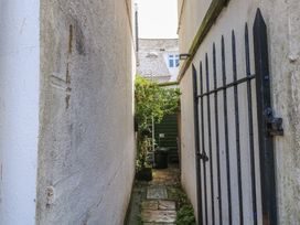 An outdoor pathway with a gate and greenery at 15D Foss Street in Dartmouth