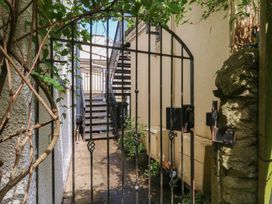 A pathway with a gate leading to stairs at 15D Foss Street in Dartmouth