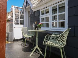 An outdoor seating area with a table and chairs at 15D Foss Street in Dartmouth