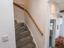 A staircase leading up with a handrail in a hallway at 15D Foss Street Dartmouth
