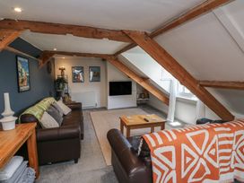 A living room with a sofa and coffee table at 15D Foss Street in Dartmouth