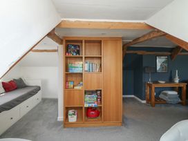 A room with a shelf filled with toys at 15D Foss Street Dartmouth