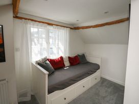 A bedroom with a daybed and pillows at 15D Foss Street Dartmouth