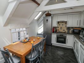 A kitchen with a table and chairs at 15D Foss Street in Dartmouth