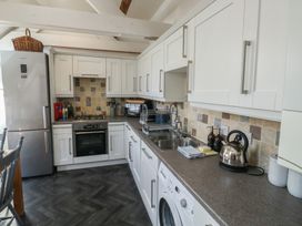 A kitchen with appliances and fixtures at 15D Foss Street in Dartmouth