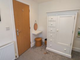 A bedroom with storage furniture and a door at 15D Foss Street in Dartmouth