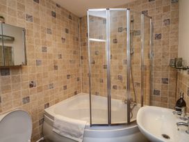 A bathroom with a shower and bathtub at 15D Foss Street in Dartmouth