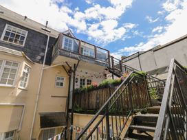 A balcony with plants and stairs at 15D Foss Street Dartmouth