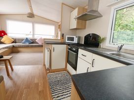 A kitchen with a microwave and oven at Foxglove 4 Ringwood