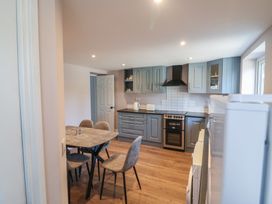 A kitchen with a table and chairs at Abinas in Kenmare