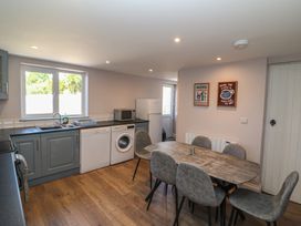 A kitchen with a table and chairs at Abinas in Kenmare