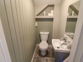A bathroom with a toilet and sink at Abinas in Kenmare