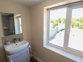 A bathroom with a sink and window at Abinas in Kenmare