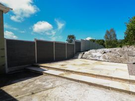 An outdoor space with a patio and stone steps at Abinas in Kenmare