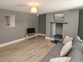 A living room with a sofa and television at Abina's, Kenmare, County Kerry