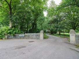A gateway entrance with a sign labeled 'FOREST SIDE' at Flat 4 Grasmere Lodge Ambleside