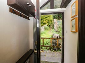 An entrance with a door and coat hooks at Dunmail Raise, Grasmere Lodge