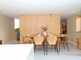 A dining room with a table and chairs at Reddaway Byre Okehampton