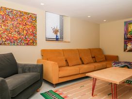 A living room with a couch and coffee table at Reddaway Byre Okehampton