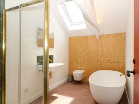 A bathroom with a shower, sink, toilet, and bathtub at Reddaway Byre in Okehampton