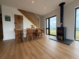 A dining room with a table and chairs at Up Top in Launceston