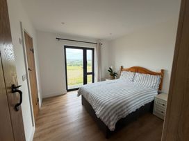 A bedroom with a bed and a plant at Up Top in Launceston