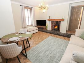A living room with a table and chairs at Corner House in Wark
