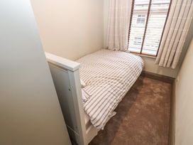 A bedroom with a bed and window at Corner House in Wark