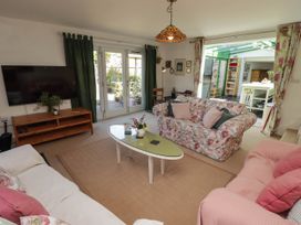 A living room with a television and sofa at 11b Market Street in Narberth