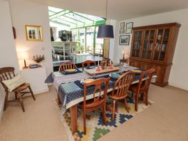 A dining room with a table and chairs at 11b Market Street Narberth
