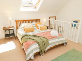 A bedroom with a bed and bedside table at 11b Market Street Narberth
