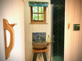 A bathroom with a sink and shower at Goldcrest Postbridge