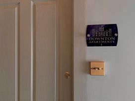 A door with a nameplate at Downton Apartments I in Alnwick