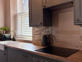 A kitchen with a sink and microwave at Downton I Alnwick