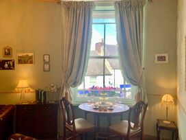 A dining room with a table and chairs at Downton I Alnwick