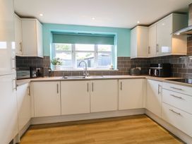 A kitchen with a sink and appliances at Frome View in Wool