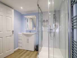 A bathroom with a shower and sink at Frome View in Wool