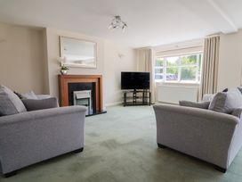 A living room with sofas and a television at Frome View in Wool