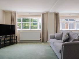 A living room with a television and a sofa at Frome View in Wool