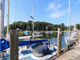 A marina with sailboats and a dock at Scoops’ Nook Caernarfon
