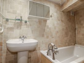 A bathroom with a sink and bathtub at 31 Tregoney Hill Mevagissey