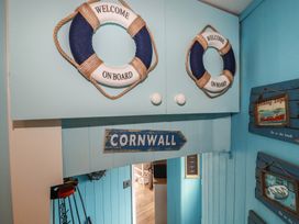 An entrance hall featuring life rings and a sign at 31 Tregoney Hill Mevagissey