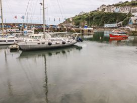 A harbor with various boats reflecting in the water at 31 Tregoney Hill Mevagissey