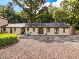 An outdoor view of a building with windows and doors at The Coach House Cottage Ballycommon